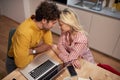 Young lonely couple cuddling while working from home, leaning heads on each other. Working from home, covid 19, lockdown,