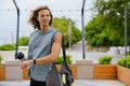 Young long-haired athletic man holding bottle of water looking aside Royalty Free Stock Photo