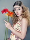 Young long-haired girl with a flowers