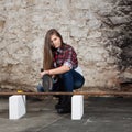 Young long-haired woman with an angle grinder Royalty Free Stock Photo