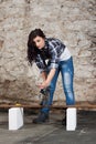 Young long-haired woman with an angle grinder Royalty Free Stock Photo