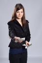 Young long-haired woman holding money Royalty Free Stock Photo
