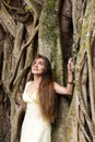 Long-haired woman near a banyan Royalty Free Stock Photo