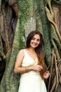 Long-haired woman near a banyan tree Royalty Free Stock Photo