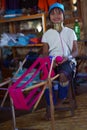 Long-necked woman handweaving in small fabric on Inle lake in Burma, Asia Royalty Free Stock Photo