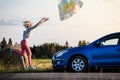 Young Lost Woman Losing a Map Because of the Wind Royalty Free Stock Photo