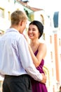 Young loughing couple on street