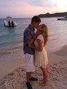 Young love at the beach at sunset at the ocean Royalty Free Stock Photo