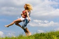 Young love couple having fun on spring meadow Royalty Free Stock Photo