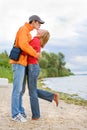 Young love Couple kissed on on coast of river Royalty Free Stock Photo