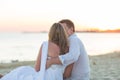 Young love couple sitting together on beach Royalty Free Stock Photo