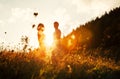 Young in love couple stay on meadow in bright sunset light