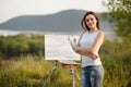 Young lovely caucasian woman painting outdoors Royalty Free Stock Photo