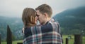 Young lovely couple in a Carpathian Mountains. Romantic dating or lovestory at rainy, foggy day. Atmospheric. 4K.