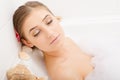 Young lovely woman in foam bath Royalty Free Stock Photo