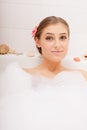 Young lovely woman in foam bath Royalty Free Stock Photo