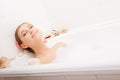 Young lovely woman in foam bath Royalty Free Stock Photo