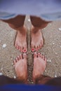 Young lover feet couple enjoying vacation on the beach together. Royalty Free Stock Photo