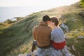 Young lovers, couple, sunset by the sea, the mountains Royalty Free Stock Photo