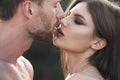 Young lovers hugging and embracing. Sensual kiss closeup. Man kissed tender woman. Couple in love tenderness and