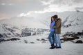 Young lovers on the winter vacations spending time in mountains Royalty Free Stock Photo