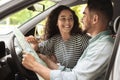 Young loving arab man and woman having car trip together