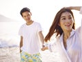 Young loving asian couple on beach Royalty Free Stock Photo