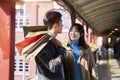 Young loving asian couple with shopping bags Royalty Free Stock Photo