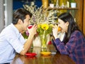 Loving young asian couple in coffee shop Royalty Free Stock Photo