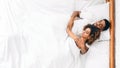 Loving couple sleeping in bed and hugging Royalty Free Stock Photo