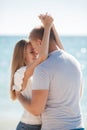 Young loving couple on the beach near the sea Royalty Free Stock Photo