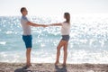 Young loving couple on the beach near the sea Royalty Free Stock Photo