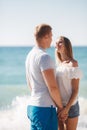 Young loving couple on the beach near the sea Royalty Free Stock Photo