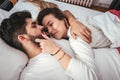 Young loving couple in the bed Royalty Free Stock Photo