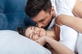 Young loving couple embrace in bed Royalty Free Stock Photo