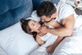 Young loving couple embrace in bed Royalty Free Stock Photo