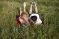 Young loving couple enjoying nature, holding hands and walking on the field with lavender. Beautiful people on nature in spring at Royalty Free Stock Photo