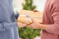 Young loving couple with gift box at home, closeup Royalty Free Stock Photo