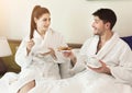 Young loving couple having breakfast in hotel room Royalty Free Stock Photo