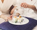 Young loving couple having breakfast in hotel room Royalty Free Stock Photo