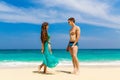 Young loving couple having fun on tropical beach. Summer vacation concept. Royalty Free Stock Photo