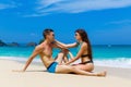 Young loving couple having fun on tropical beach. Summer vacation concept. Royalty Free Stock Photo