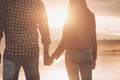 Young loving couple holding hands at sunset Royalty Free Stock Photo