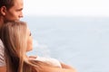 Young loving couple looking at a beautiful seaview