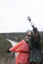 Young loving couple making selfie in the hillside to the river Royalty Free Stock Photo