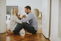 Young loving couple sitting on the floor Royalty Free Stock Photo