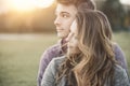 Young loving couple sitting on the grass Royalty Free Stock Photo