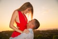 Young loving couple standing next to the stone gazebo with the s Royalty Free Stock Photo