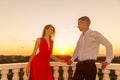 Young loving couple standing next to the stone gazebo with the s Royalty Free Stock Photo