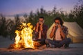 Couple Camping Near Campfire Royalty Free Stock Photo